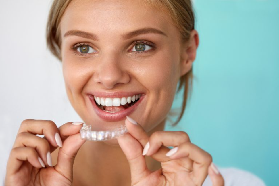 A beautiful lady wearing her Invisalign A beautiful lady wearing her Invisalign