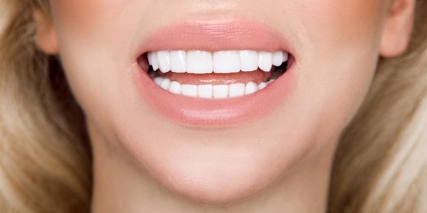 A Smiling Face With Beautiful White Teeth.  A Smiling Face With Beautiful White Teeth.