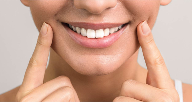 A Young Lady Showing Her Beautiful Set of Teeth After Her Smile Dentistry