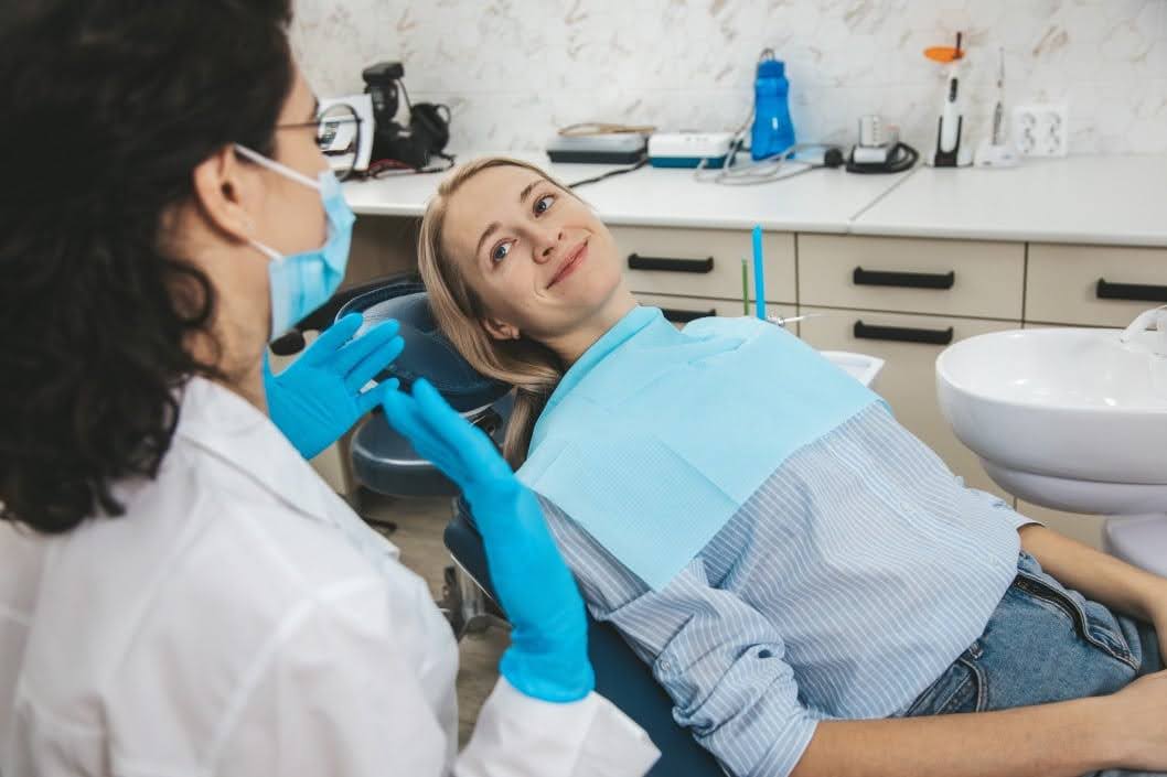 A Biologic Dentistry Specialist Explaining Her Dental Procedure to a Young Lady
 A Biologic Dentistry Specialist Explaining Her Dental Procedure to a Young Lady