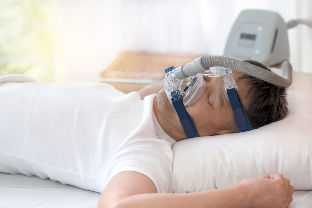 A Man Using a Sleep Apnea Machine to Treat Sleep Apnea
A Man Using a Sleep Apnea Machine to Treat Sleep Apnea