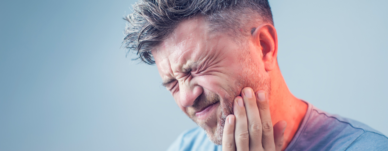 A Man Feeling Severe Jaw Pain
A Man Feeling Severe Jaw Pain